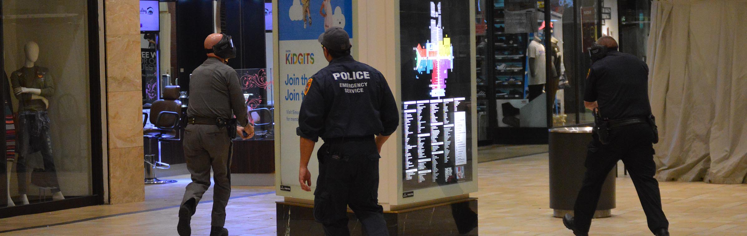 police participating in an active shooter drill in a mall